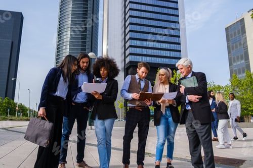 Preview: Group of workers of a company meet outdoors