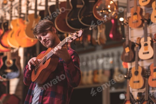 Preview: A young musician playing the ukulele
