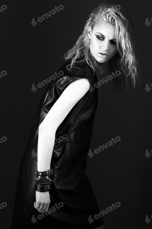 Preview: Daring girl model in black leather dress, style of rock
