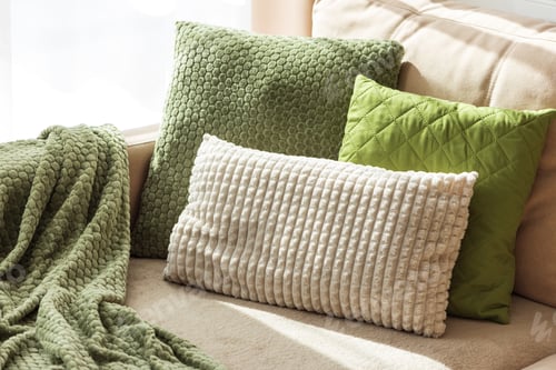 Preview: Textured Pillows and Blanket on Cozy Beige Sofa