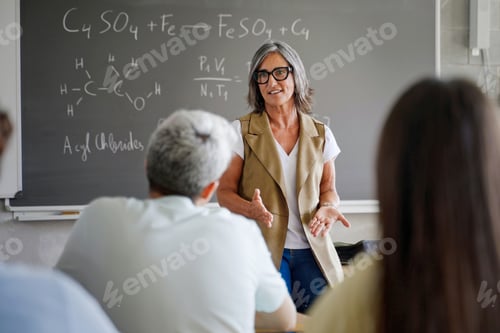 Preview: High School senior Teacher explaining chemistry lesson To students learning Tech Science course
