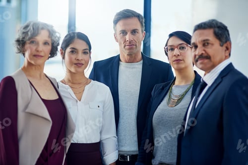 Preview: Cropped portrait of a diverse group of businesspeople standing together in their office