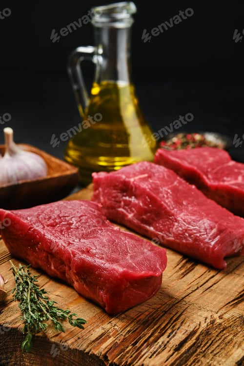 Preview: Closeup view of raw boneless strip steak loin on cutting board