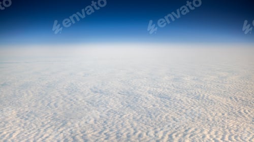 Preview: The beautiful cloudscape with clear blue sky. A view from airplane window.