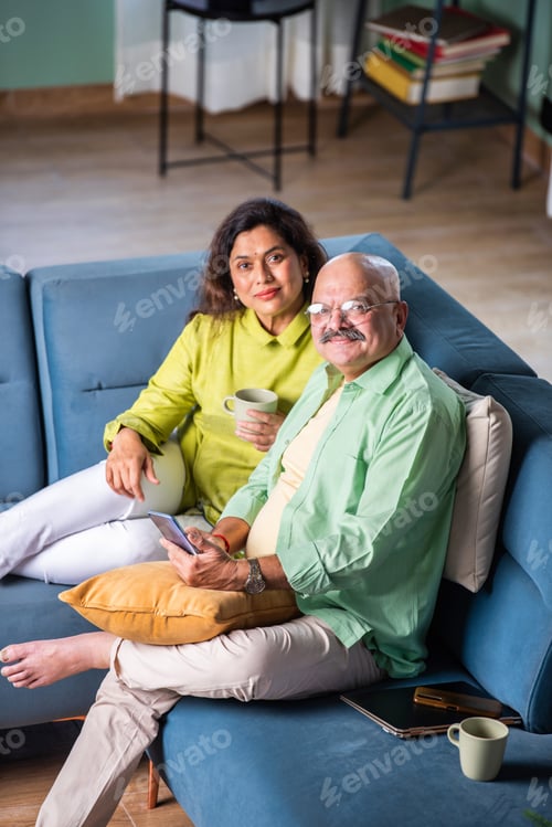 Preview: Happy Senior Indian Couple Using Smartphone at home for video call or selfie