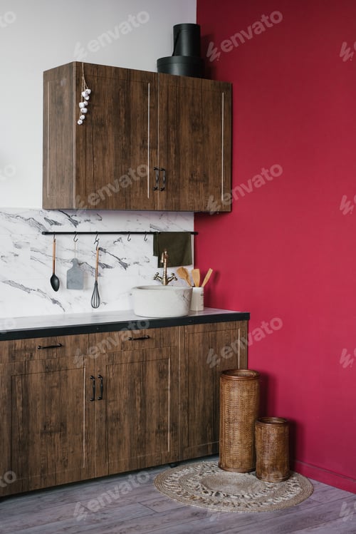 Preview: Wooden kitchen against the background of a burgundy wall and marble ceramic tiles