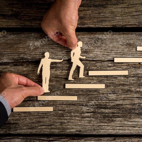 Preview: Business teamwork concept with the hands of two businesspeople supporting paper cut outs