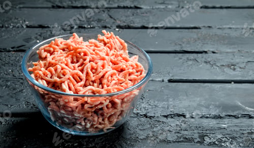 Preview: Raw minced meat in a glass bowl .