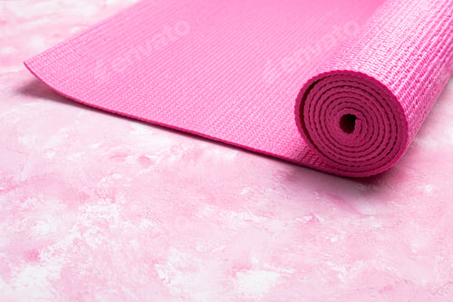Preview: Rolled Yoga Mat on Pink Textured Surface