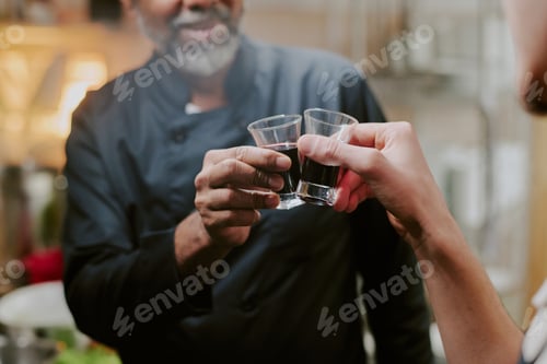 Preview: Unrecognizable Male Hands Holding Shot Glasses
