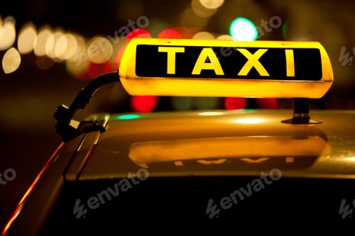 Preview: Glowing Taxi Sign Amidst City Lights at Night