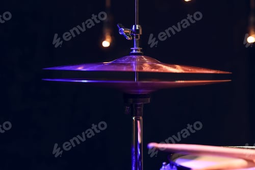 Preview: Hi-hat close up of plates with on a dark background.