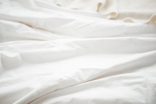 Preview: Selective focus of white blanket at bedroom