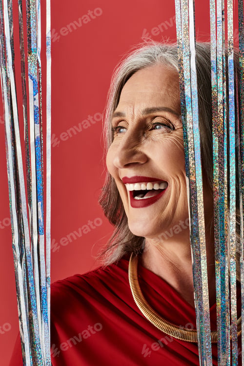 Preview: A joyful celebration of Christmas and New Year by a mature woman with grey hair