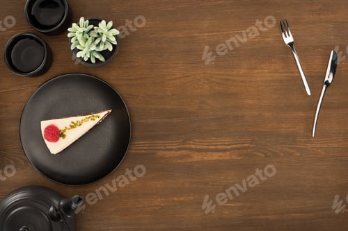 Preview: top view of tea set and gourmet dessert on wooden table
