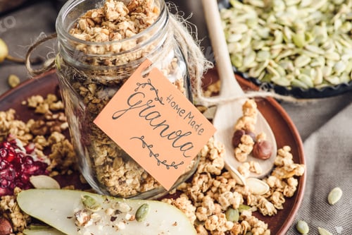 Preview: homemade tasty granola in glass jar with tag