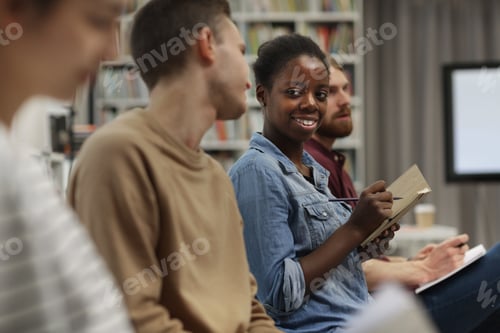 Preview: African woman sitting at lecture
