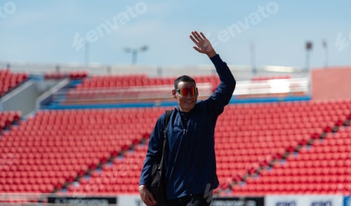 Preview: Disabled athletes prepare their bodies on amphitheater in a sports arena on a sunny day