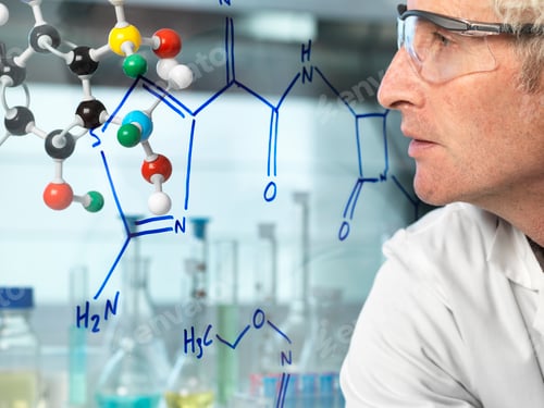 Preview: Scientist with ball and stick molecular model looking at new drug formula written on glass