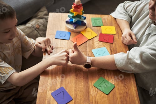 Preview: Child with Disability Playing Educational Game With an Elderly Person