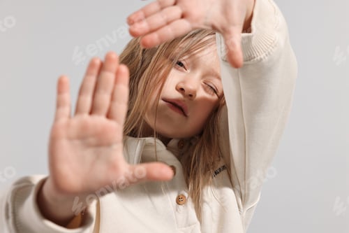 Preview: Fashion concept. Stylish girl posing on light grey background