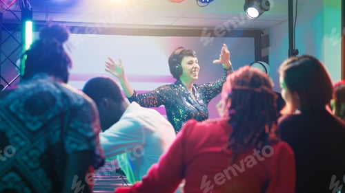 Preview: Young DJ mixing funky music at party