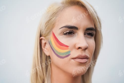 Preview: Young lesbian woman during lgbt pride protest - Focus on face