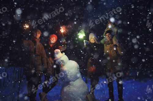 Preview: Group Of Friends With Snowman Sparklers Party, Christmas Night And Happy New Year