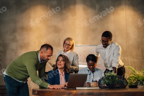 Preview: Happy multiracial business team working together during a meeting