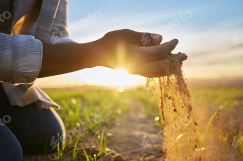 Preview: Proud of my produce. Cropped shot of a farmer holding soil.