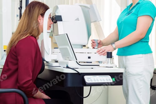 Preview: Beautiful woman having an eye lens exam