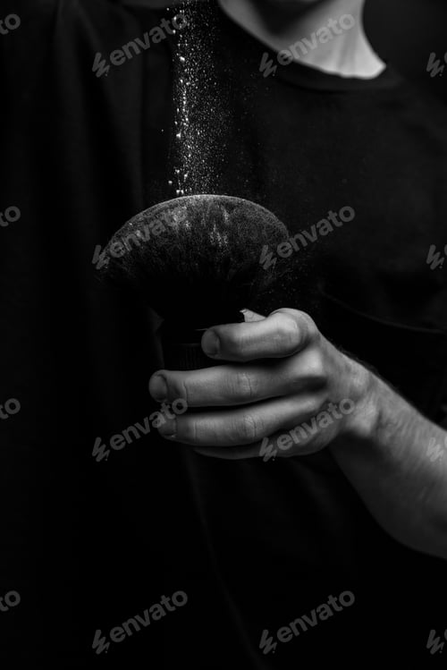 Preview: barber holding a brush for powder