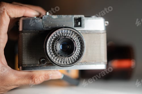 Preview: Close-Up of a Vintage Camera in Hand