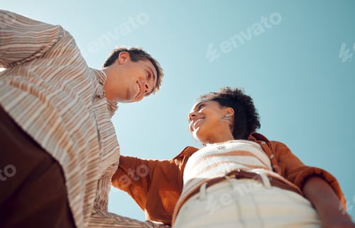 Preview: Happy, outdoor and view from the bottom of a couple standing with blue sky while on holiday. Happin