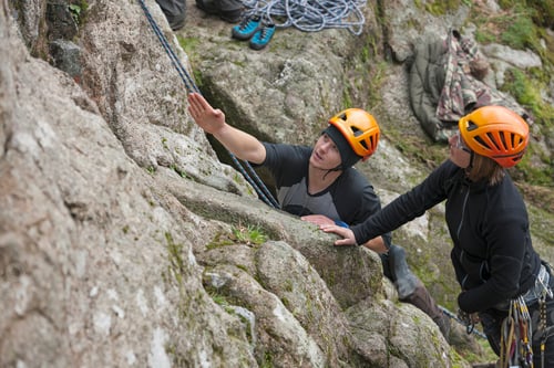 Preview: Rock climbers in action, securing their path up the craggy terrain.