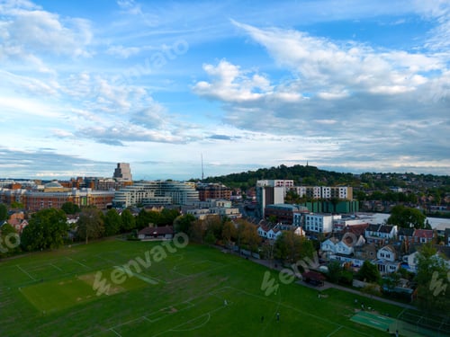 Preview: View of the green football field and blue cloudy sky. Harrow, Greater London, England, UK.