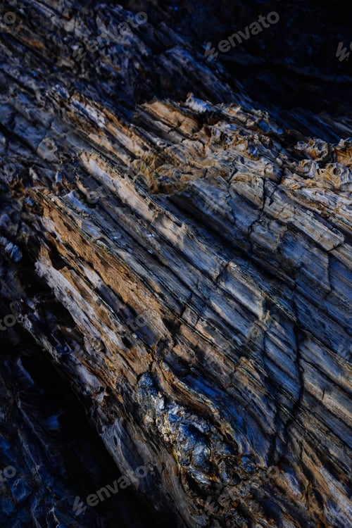 Preview: Vertical aerial shot of the beautiful patterns of the rocky cliffs