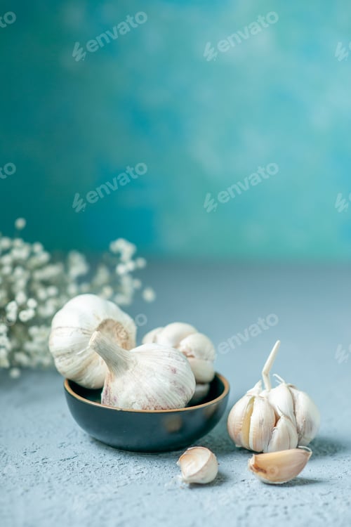 Preview: front view fresh garlics on light blue background vegetable sour pepper seasoning plant food
