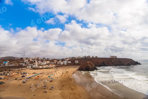 Preview: Panoramic view on Atlantic ocean beach in small Morrocan town Iguer Ouzrou