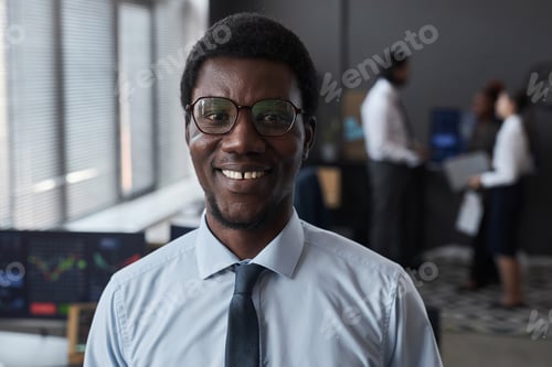 Preview: Successful young broker working in office