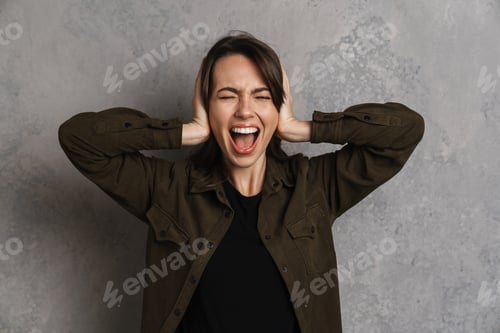 Preview: Nervous beautiful girl screaming and covering her ears