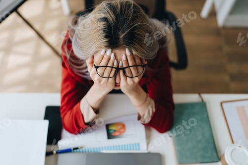 Preview: Portrait of business owner, woman using computer and financial statements Anxious expression on expa
