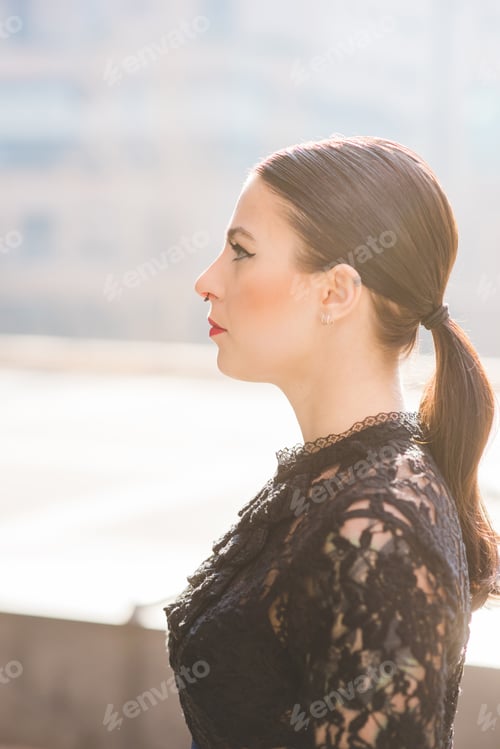 Preview: Young beautiful woman outdoor city