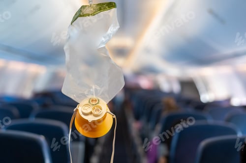 Preview: oxygen mask drop from the ceiling compartment on airplane