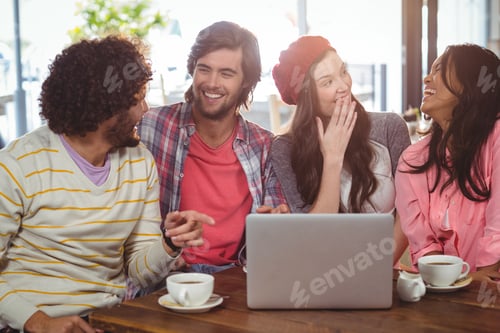 Preview: Laughing Friends Enjoying Coffee With Laptop In Cafe