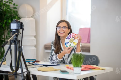 Preview: Joyful good looking woman speaking on camera