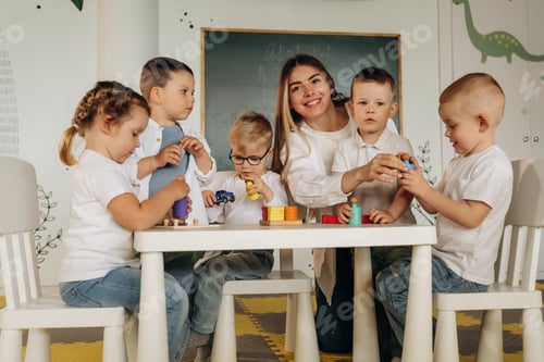 Preview: Teacher and Children Playing with Toys at Table