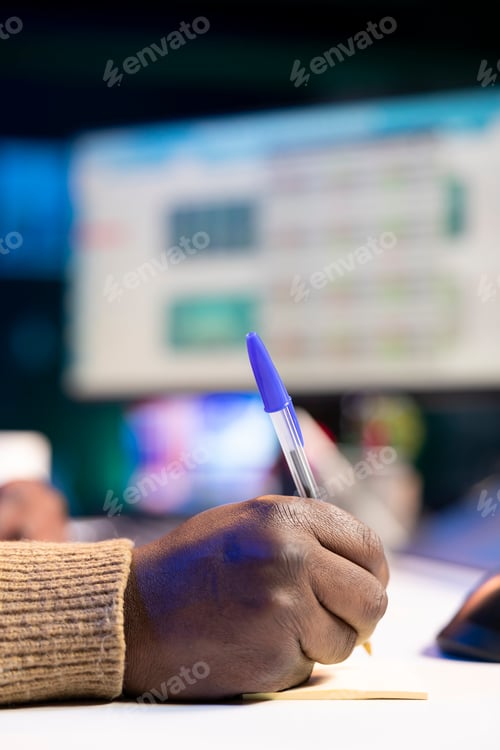 Preview: African american specialist closing the monthly revenue balance