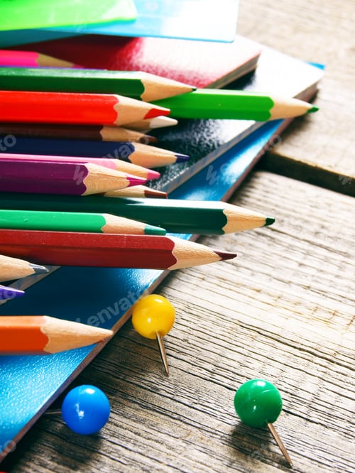 Preview: School tools. On wooden background.
