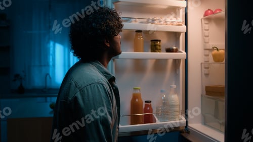 Preview: Home kitchen at night dark room hungry Hispanic man Indian male guy want eat rubbing belly open